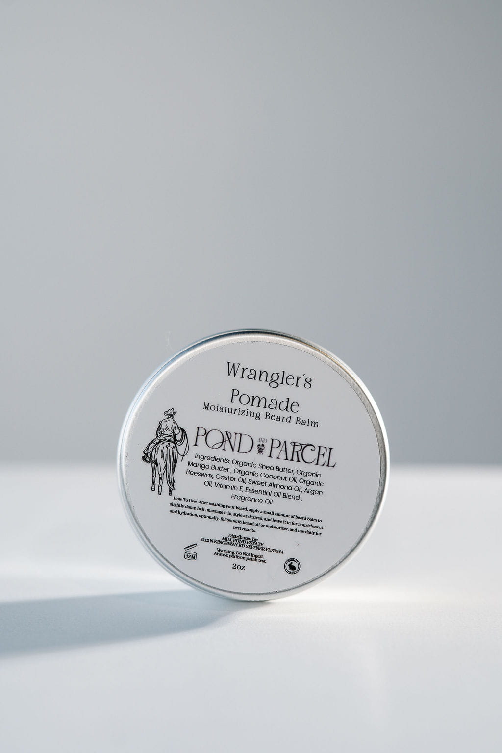 A round metal tin of Wrangler's Pond's Parcel Pomade.