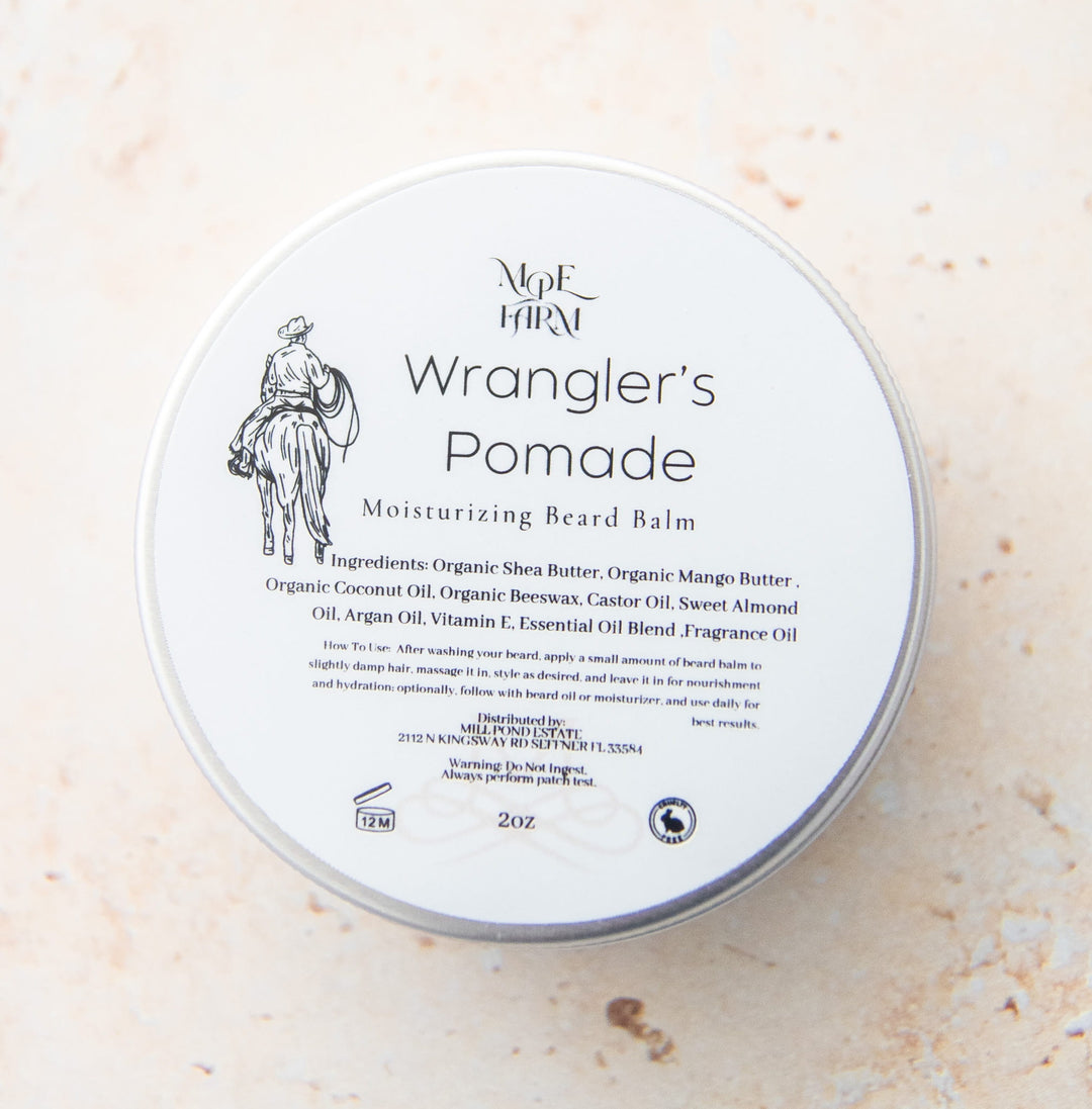 Wrangler's Pomade container on a light beige background.